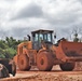 A  wheel loader returns for another load of dirt on the site of an active construction project