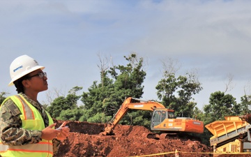 A Civil Engineer Corps officer conducts a site visit on an active construction project in Guam