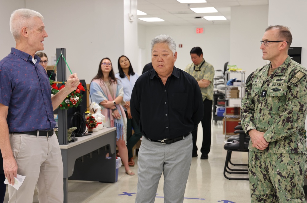 NAVFAC PAC Commander presents coin to NAVFAC Hawaii employees