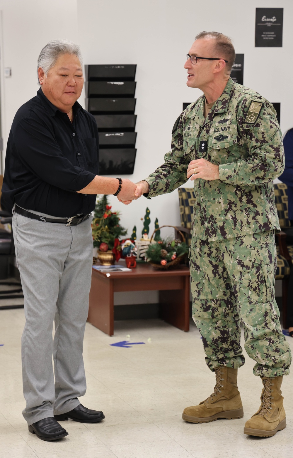 NAVFAC PAC Commander presents coin to NAVFAC Hawaii employees