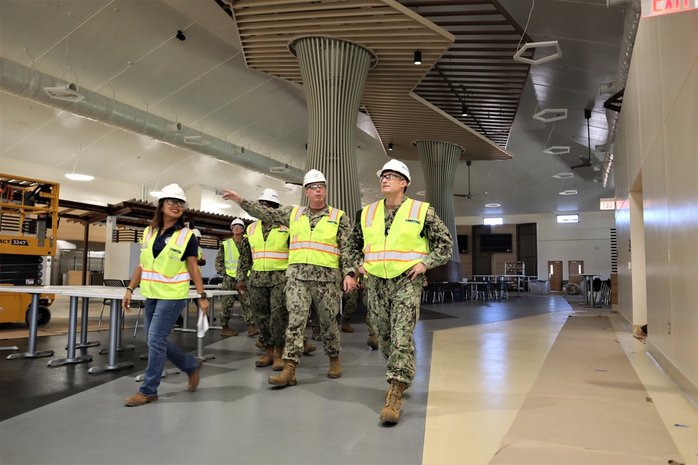 OICC staff walk through a nearly-completed dining facility on the new Marine Corps Base Camp Blaz