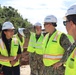 A construction manager briefs the Commander of NAVFAC Pacific at the site of a machine gun range under construction