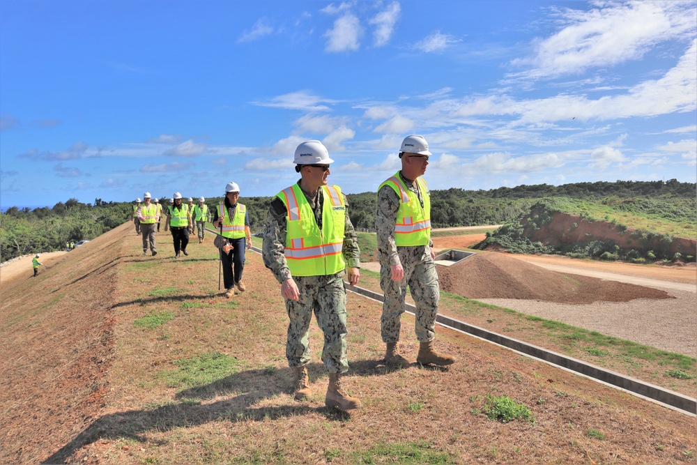 NAVFAC staff tour a machine gun range under construction on Marine Corps Base Camp Blaz