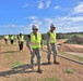 NAVFAC staff tour a machine gun range under construction on Marine Corps Base Camp Blaz