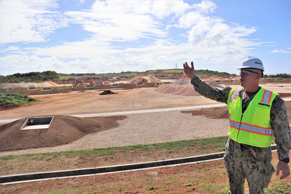 The Commanding Officer of OICC Marine Corps Marianas discusses construction progress at a machine gun range