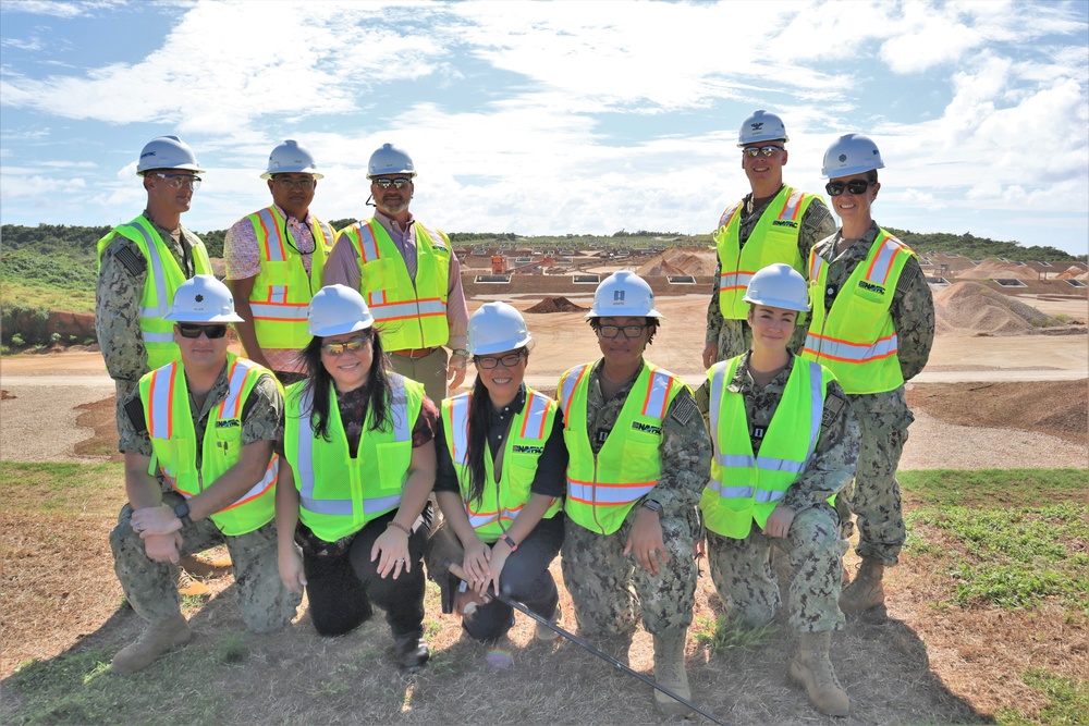 NAVFAC staff pose for a photo during a site visit