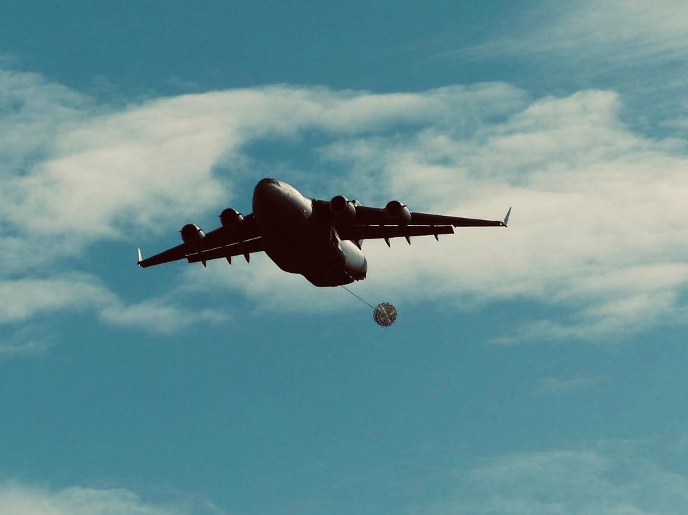 Dutch C-17 Globemaster III begins drogue parachute release for U.S. Army 5th QM TADC’s 16ft Type V Platform, carrying one M1097A1 (HMMWV).