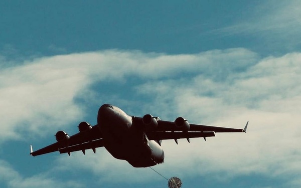 Dutch C-17 Globemaster III begins drogue parachute release for U.S. Army 5th QM TADC’s 16ft Type V Platform, carrying one M1097A1 (HMMWV).