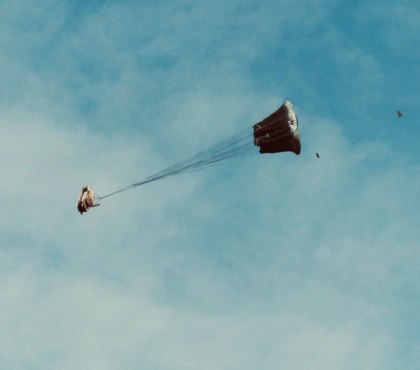 Two G11 Parachutes mid-extraction as the U.S. Army 16ft Type V Platform begins descent