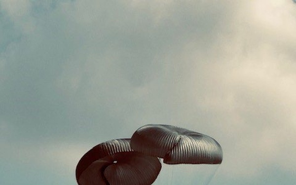 U.S. Army M1097A1 550-1000ft Above Ground Level (AGL), descending after successful parachute deployment