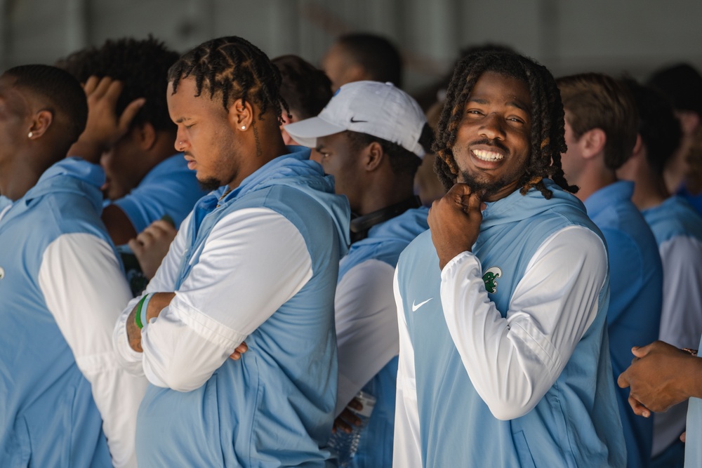 UF Gators and TU Green Wave football teams visit MacDill AFB ahead of Gasparilla Bowl