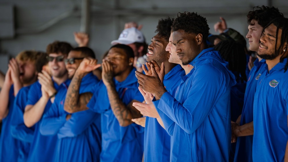 UF Gators and TU Green Wave football teams visit MacDill AFB ahead of Gasparilla Bowl