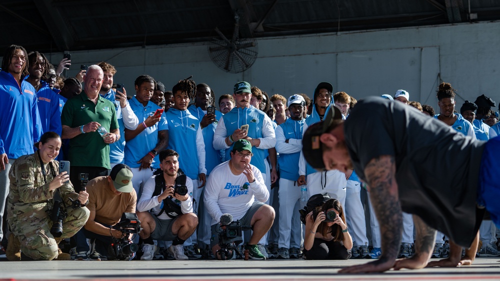 UF Gators and TU Green Wave football teams visit MacDill AFB ahead of Gasparilla Bowl