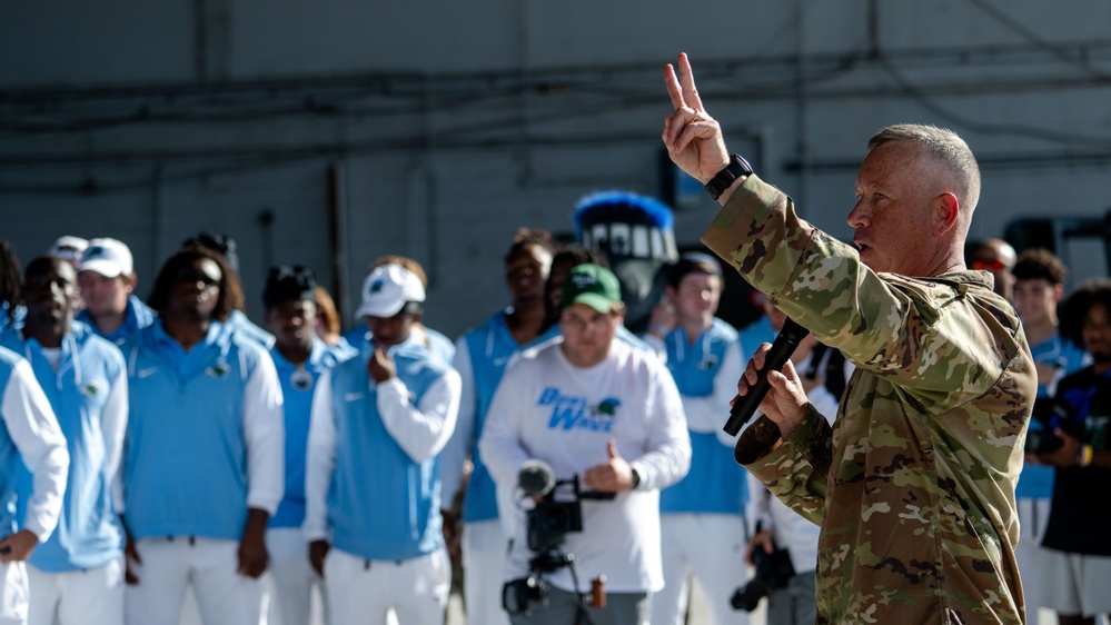 UF Gators and TU Green Wave football teams visit MacDill AFB ahead of Gasparilla Bowl