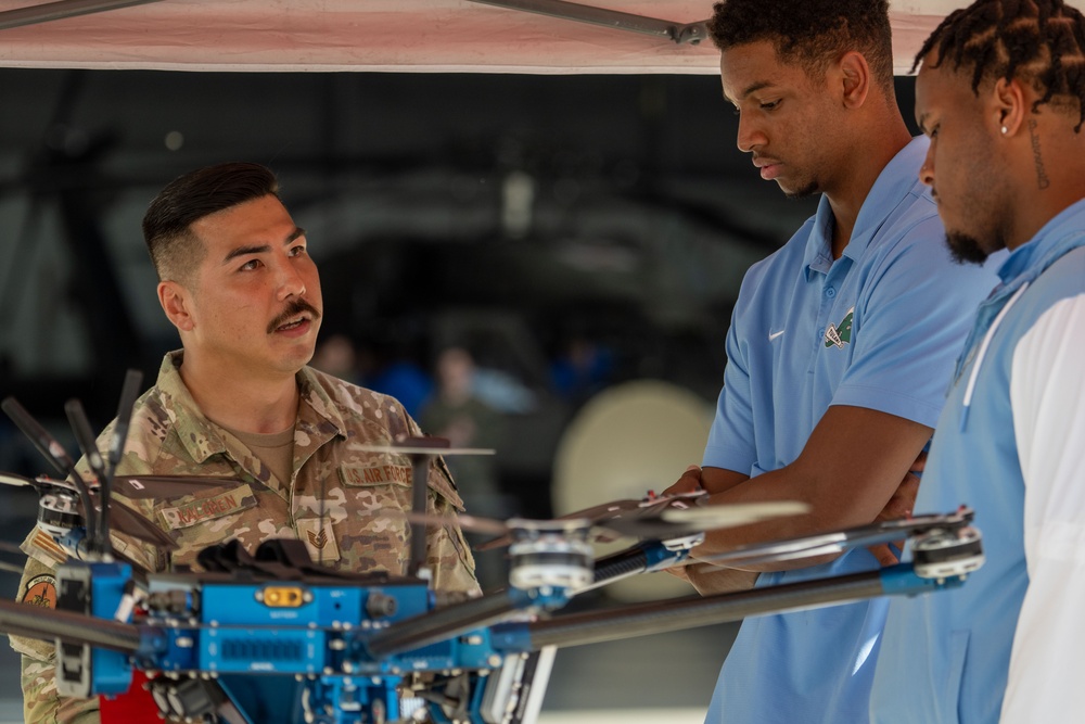 UF Gators and TU Green Wave football teams visit MacDill AFB ahead of Gasparilla Bowl