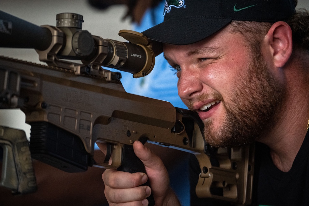 UF Gators and TU Green Wave football teams visit MacDill AFB ahead of Gasparilla Bowl