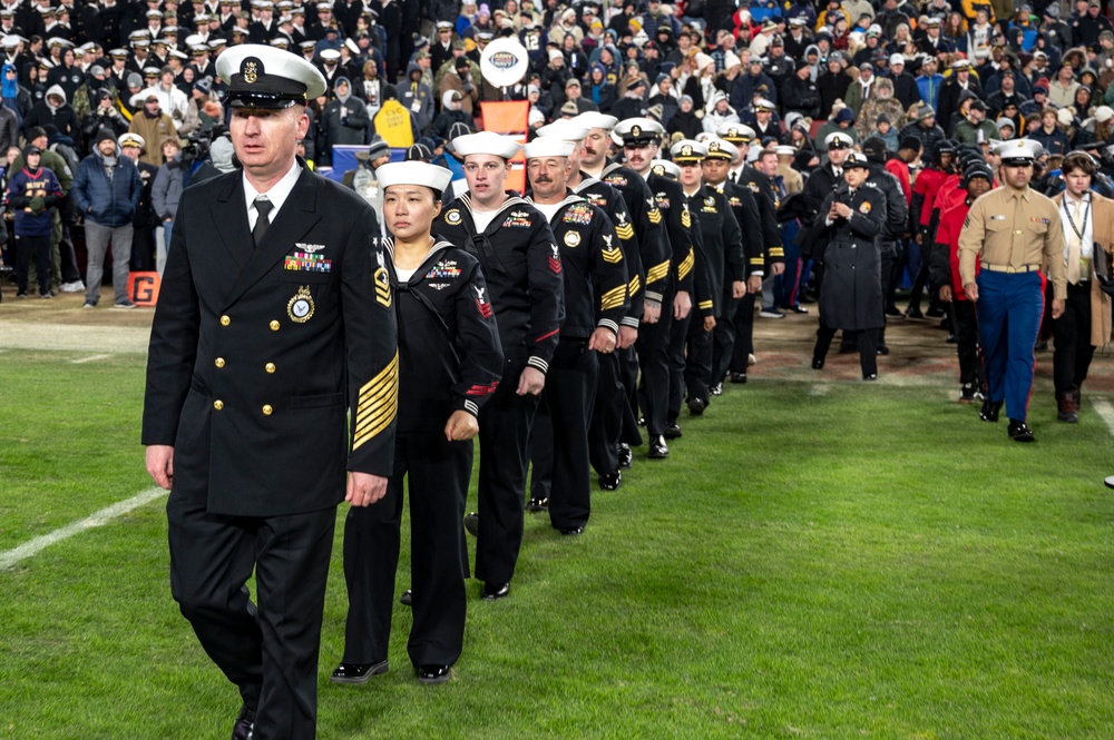 U.S. Navy Recruiters of the Year walk onto the Field for an Swear in Ceremony during the Army Navy Game