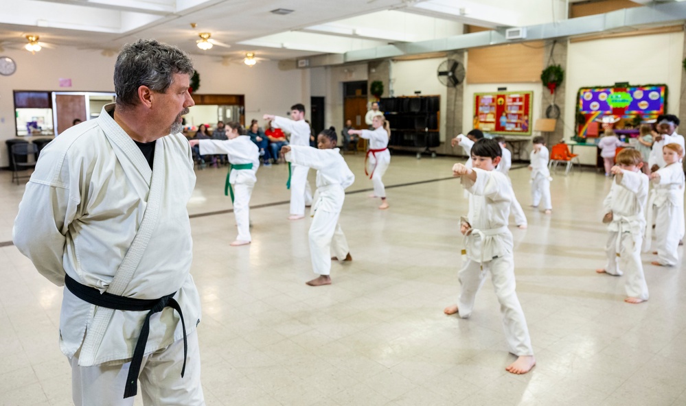 Black belts and boundary lines: Real estate specialist lives a double life of discipline and defense