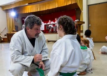 Black belts and boundary lines: Real estate specialist lives a double life of discipline and defense