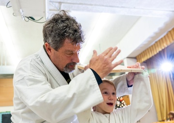 Black belts and boundary lines: Real estate specialist lives a double life of discipline and defense