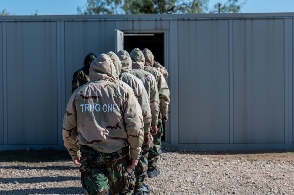 Trainees assigned to flights 100-103 participate in Mask Confidence Training Dec. 19, 2024