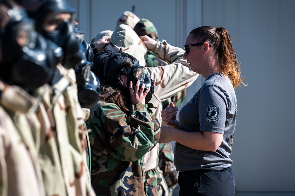 Trainees assigned to flights 100-103 participate in Mask Confidence Training Dec. 19, 2024