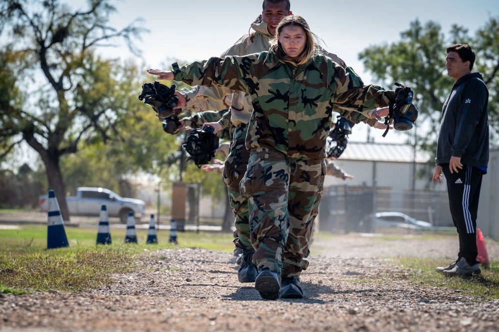 Trainees assigned to flights 100-103 participate in Mask Confidence Training Dec. 19, 2024