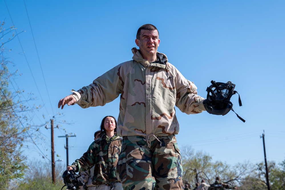 Trainees assigned to flights 100-103 participate in Mask Confidence Training Dec. 19, 2024