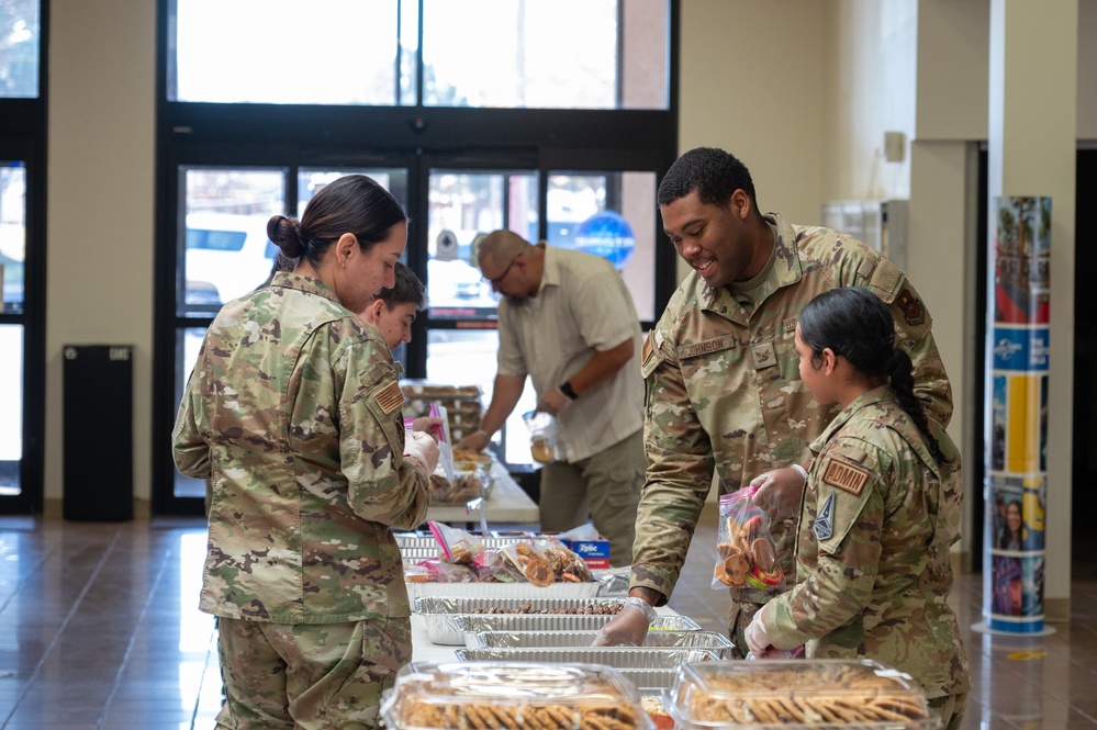 Members from Kirtland Air Force Base package cookies during Operation Cookie Drop