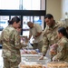 Members from Kirtland Air Force Base package cookies during Operation Cookie Drop