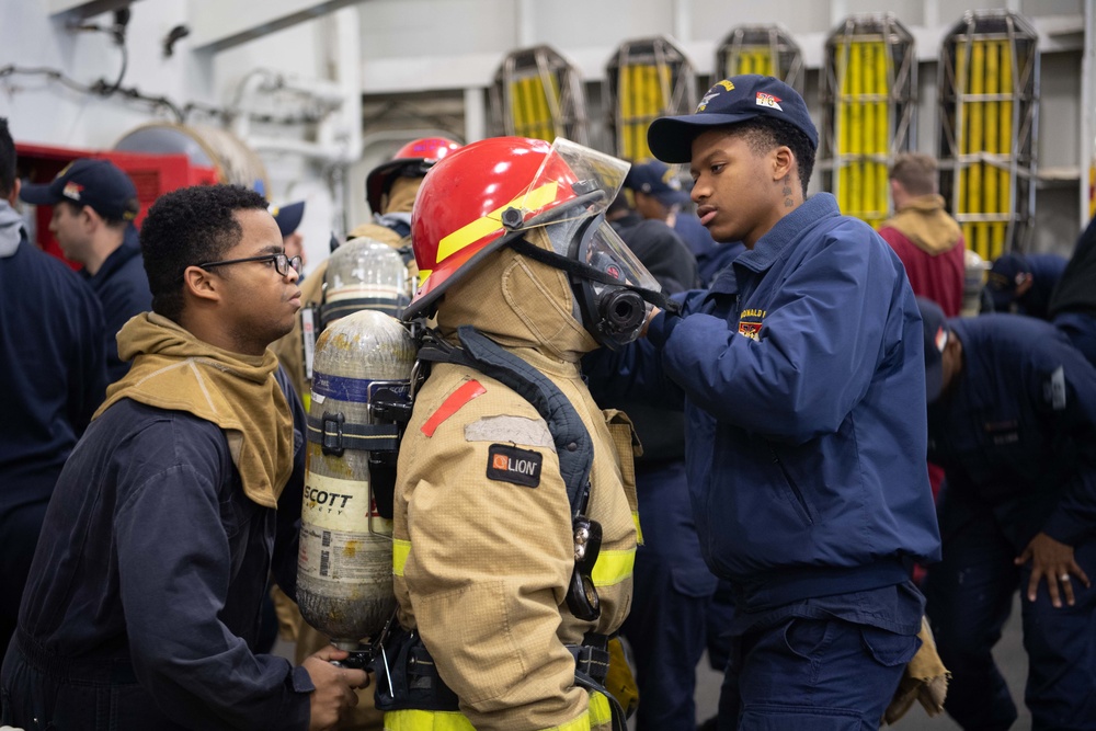 USS Ronald Reagan (CVN 76) conducts a joint damage control drill