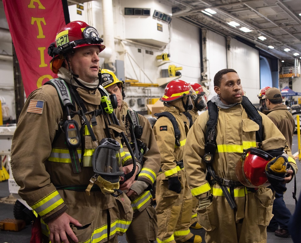 USS Ronald Reagan (CVN 76) conducts a joint damage control drill