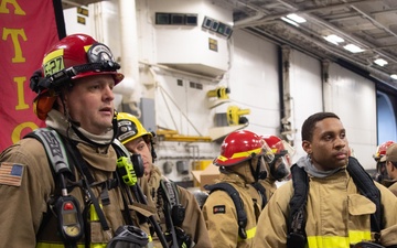 USS Ronald Reagan (CVN 76) conducts a joint damage control drill