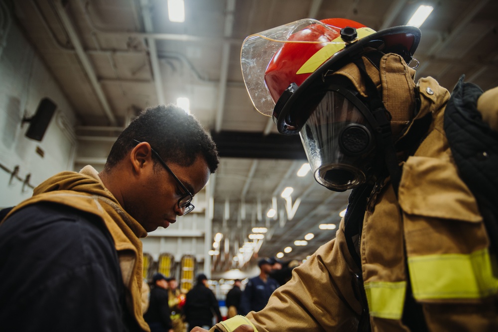 USS Ronald Reagan (CVN 76) conducts a joint damage control drill