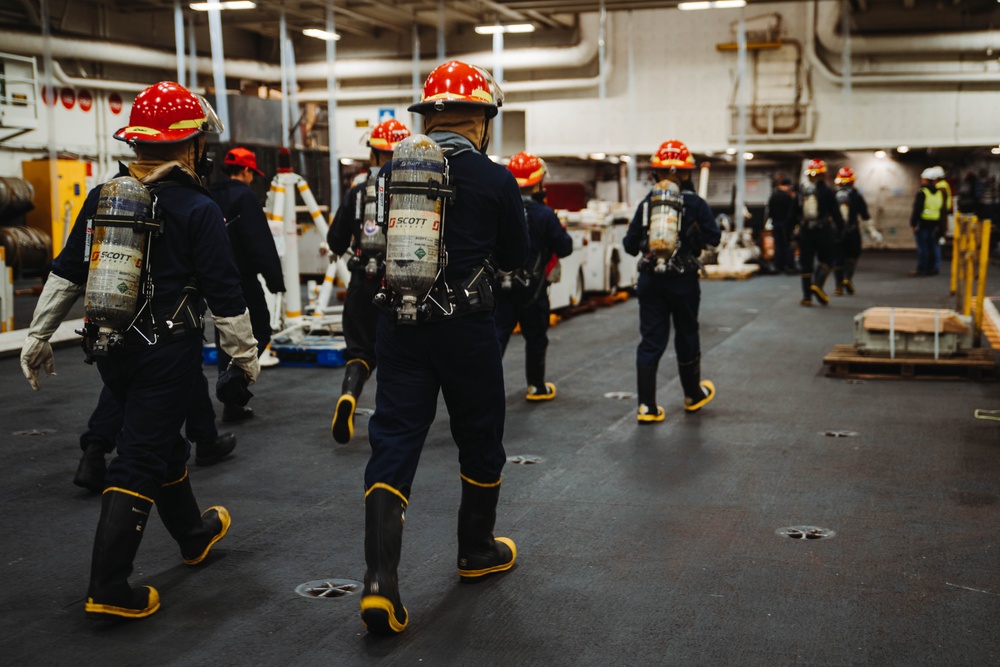 USS Ronald Reagan (CVN 76) conducts a joint damage control drill