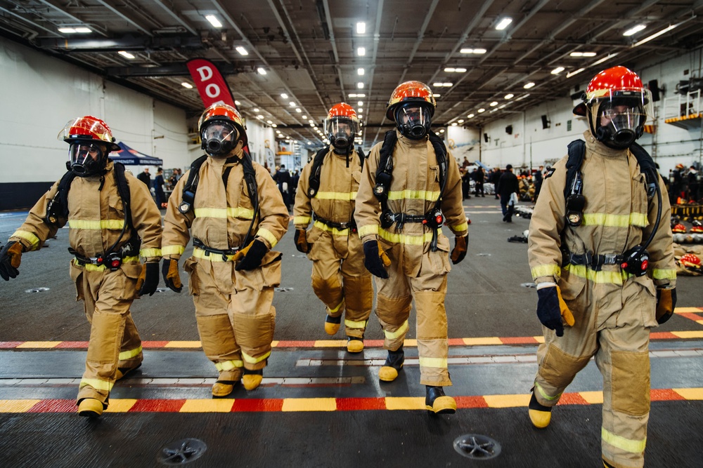 USS Ronald Reagan (CVN 76) conducts a joint damage control drill