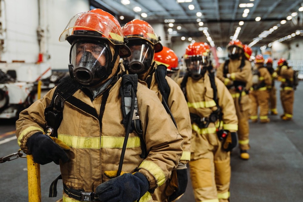 USS Ronald Reagan (CVN 76) conducts a joint damage control drill