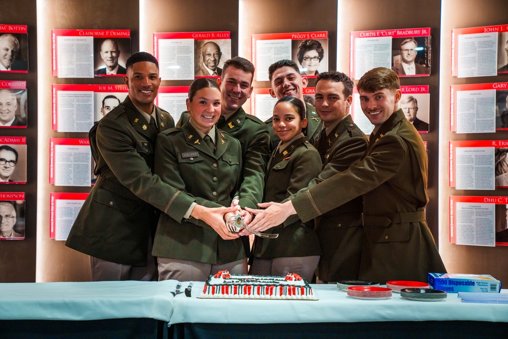 Univ. of Ark. Army Officers Celebrate Commissioning with Ceremonial Cake-Cutting