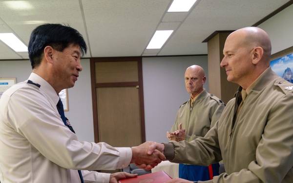 Col. Ronnie D. Michael, awards Mr. Ryu Deuk Gon Pohang Nambu Fire Station Chief with the Certificate of Commendation