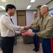 Col. Ronnie D. Michael, awards Mr. Ryu Deuk Gon Pohang Nambu Fire Station Chief with the Certificate of Commendation