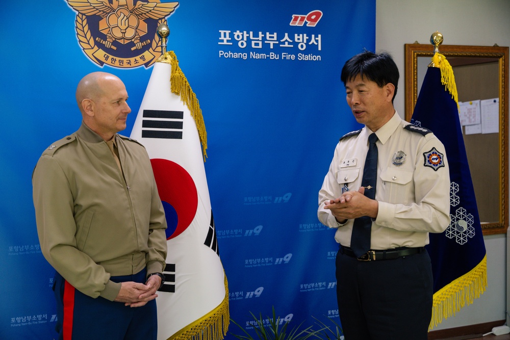 Col. Ronnie D. Michael awards Mr. Ryu Deuk Gon Pohang Nambu Fire Station Chief with the Certificate of Commendation