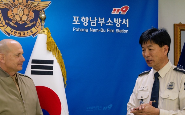 Col. Ronnie D. Michael awards Mr. Ryu Deuk Gon Pohang Nambu Fire Station Chief with the Certificate of Commendation