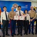 Col. Ronnie D. Michael, awards Mr. Ryu Deuk Gon Pohang Nambu Fire Station Chief with the Certificate of Commendation