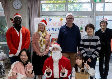 U.S. Marine Corps gives gifts to a local shelter in the city of Naha through Merry Marine Toy Drive