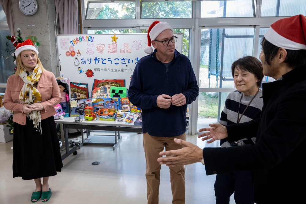 U.S. Marine Corps gives gifts to a local shelter in the city of Naha through Merry Marine Toy Drive