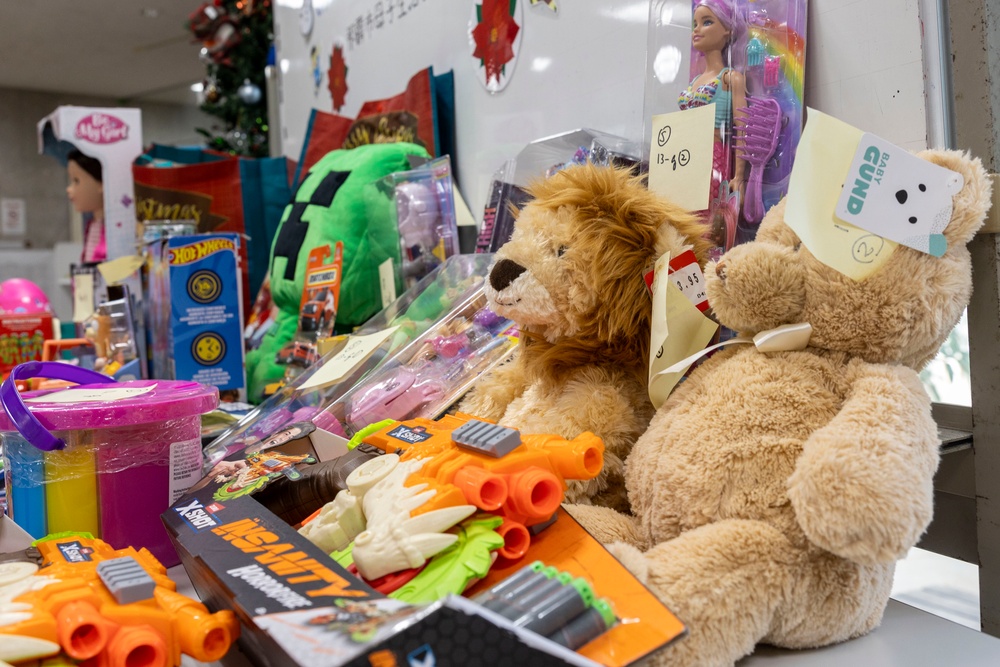 U.S. Marine Corps gives gifts to a local shelter in the city of Naha through Merry Marine Toy Drive