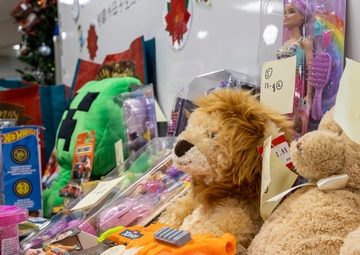 U.S. Marine Corps gives gifts to a local shelter in the city of Naha through Merry Marine Toy Drive