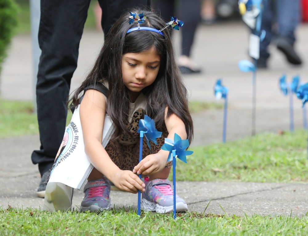 Youth display pinwheels to promote prevention of child abuse