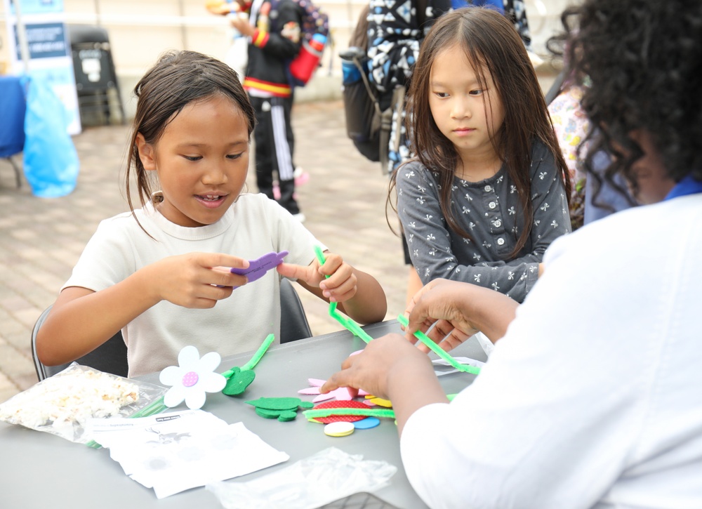 Youth display pinwheels to promote prevention of child abuse