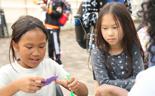 Youth display pinwheels to promote prevention of child abuse